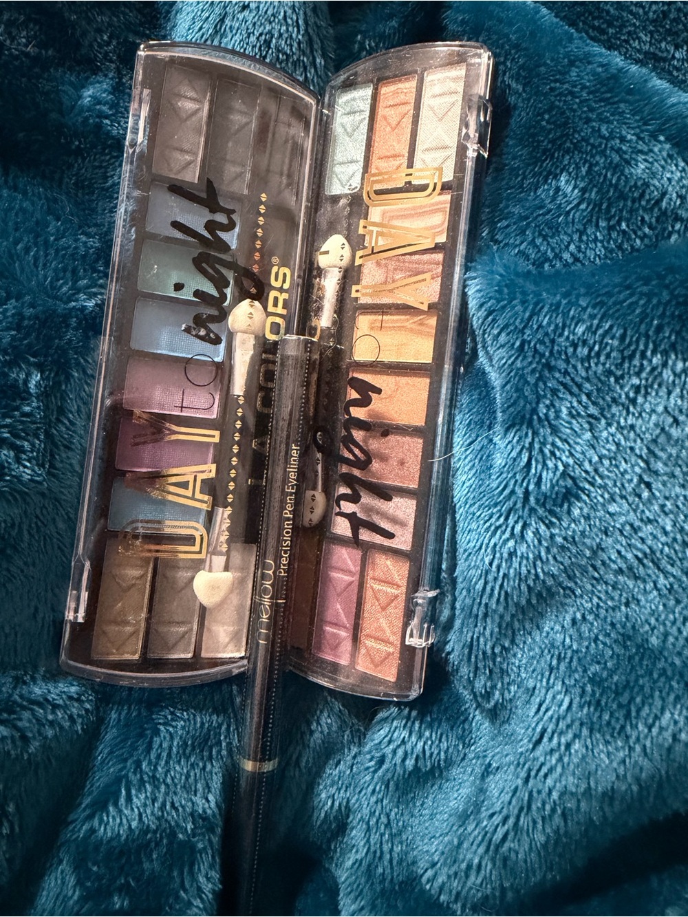 2 Day to Night Eyeshadow Palettes, 1 Black Eyeliner and 1 Baking Oil